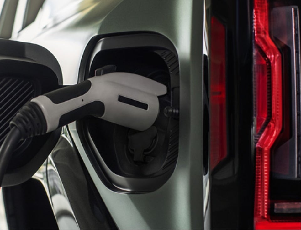 Close up of charging port with charger plugged in on a GMC Hummer EV SUV - Blaise Alexander GMC of Selinsgrove in SELINSGROVE PA